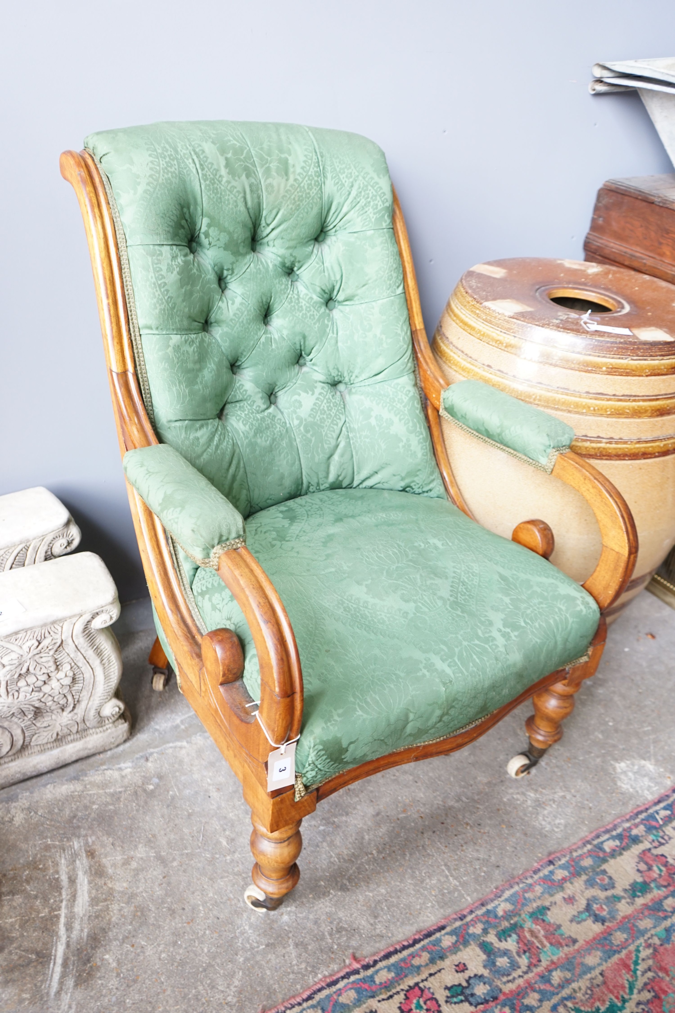 A Victorian mahogany green upholstered open armchair, width 66cm, depth 78cm, height 92cm